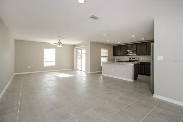 a view of a kitchen with a sink and a stove top oven
