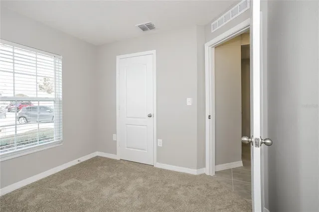 an empty room that has a window