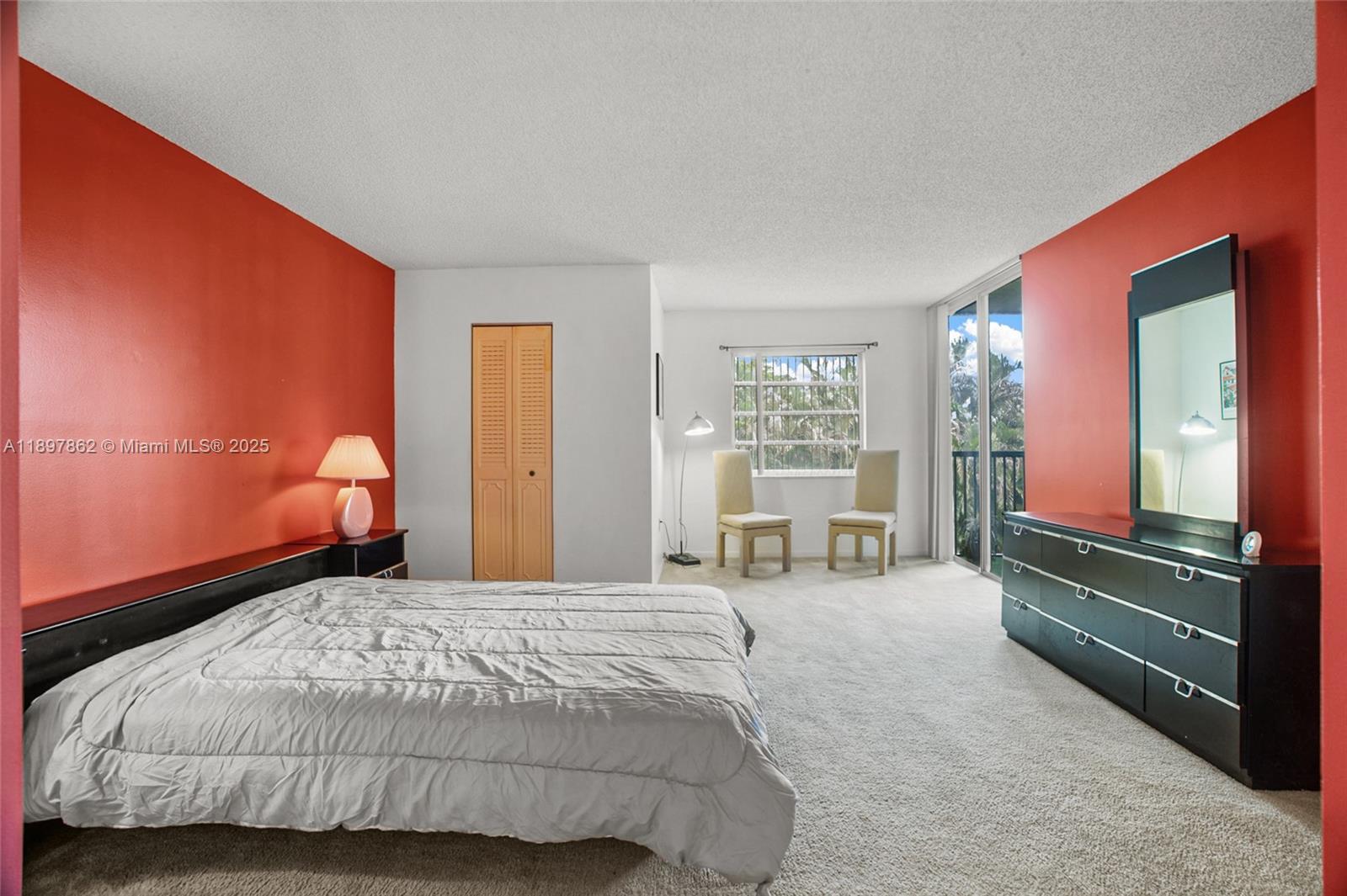 3940 Inverrary Boulevard, Unit 304A Lauderhill, FL 33319 - Photo 11 of 28 a bedroom with a bed and large windows