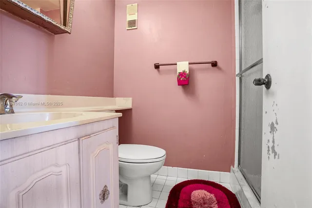 a bathroom with a sink toilet and vanity