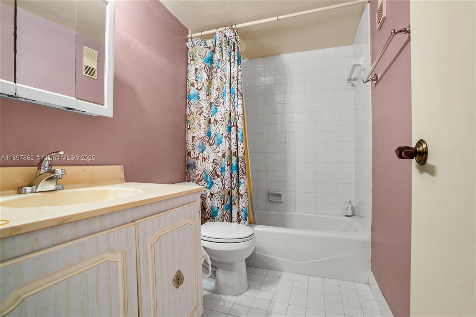 3940 Inverrary Boulevard, Unit 304A Lauderhill, FL 33319 - Photo 17 of 28 a bathroom with a sink a toilet and shower
