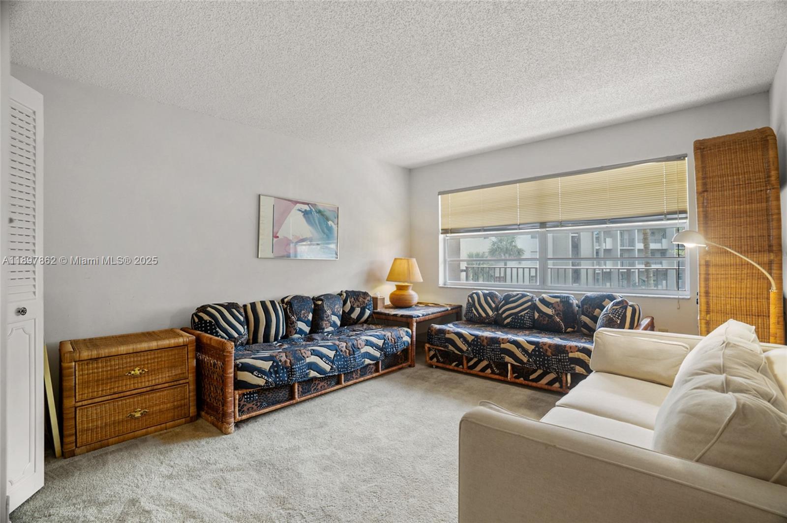 3940 Inverrary Boulevard, Unit 304A Lauderhill, FL 33319 - Photo 18 of 28 a living room with furniture and a window