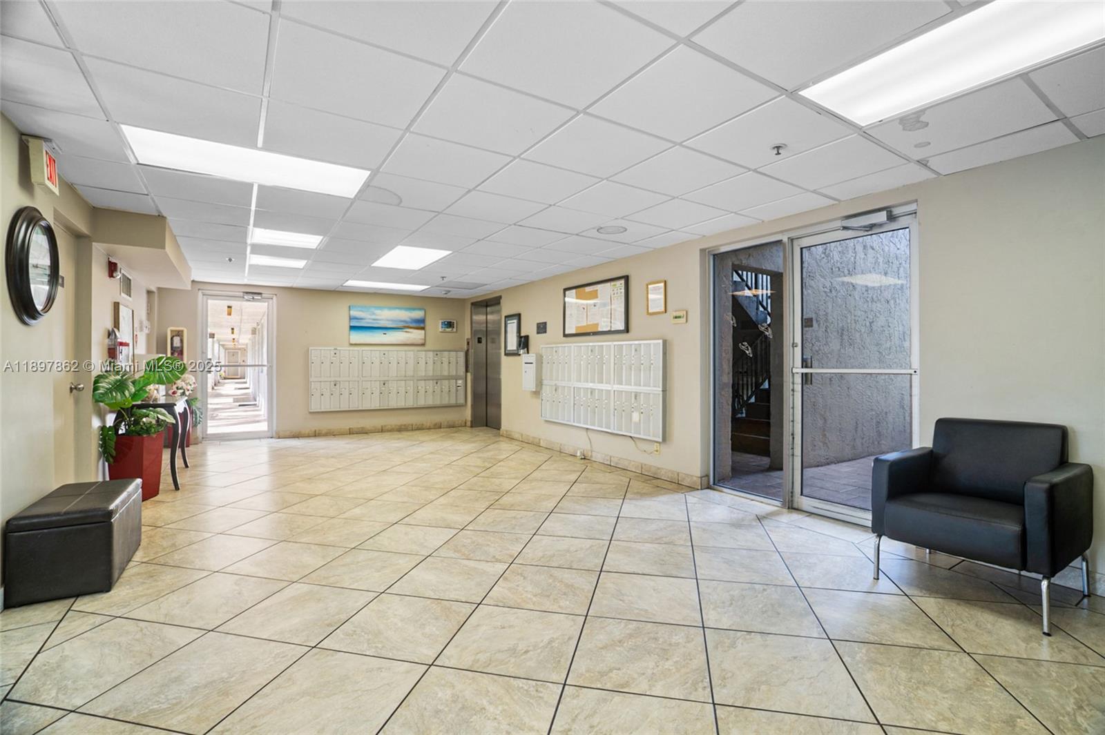 3940 Inverrary Boulevard, Unit 304A Lauderhill, FL 33319 - Photo 24 of 28 a living room with furniture and a rug
