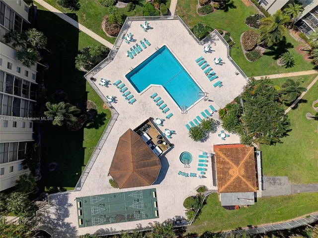 an aerial view of a house with garden space and street view