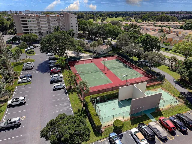 an aerial view of a pool patio yard and outdoor seating