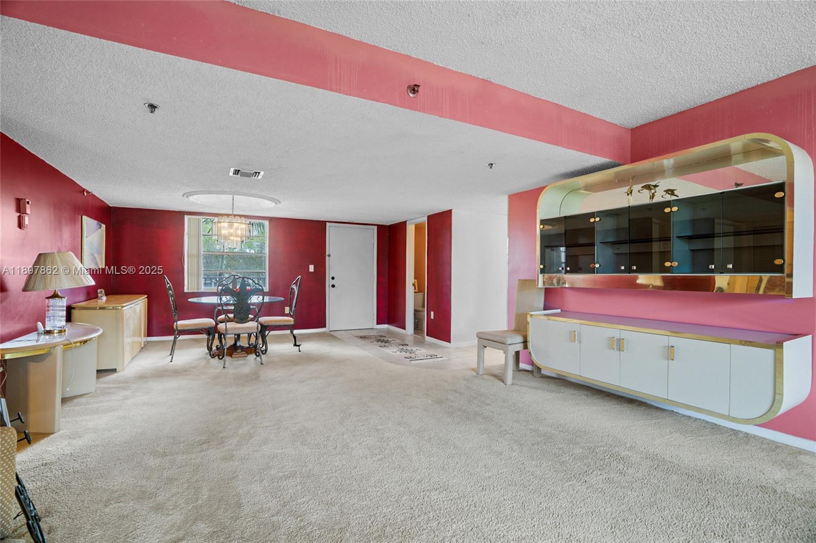 3940 Inverrary Boulevard, Unit 304A Lauderhill, FL 33319 - Photo 6 of 28 a living room with furniture and flat screen tv