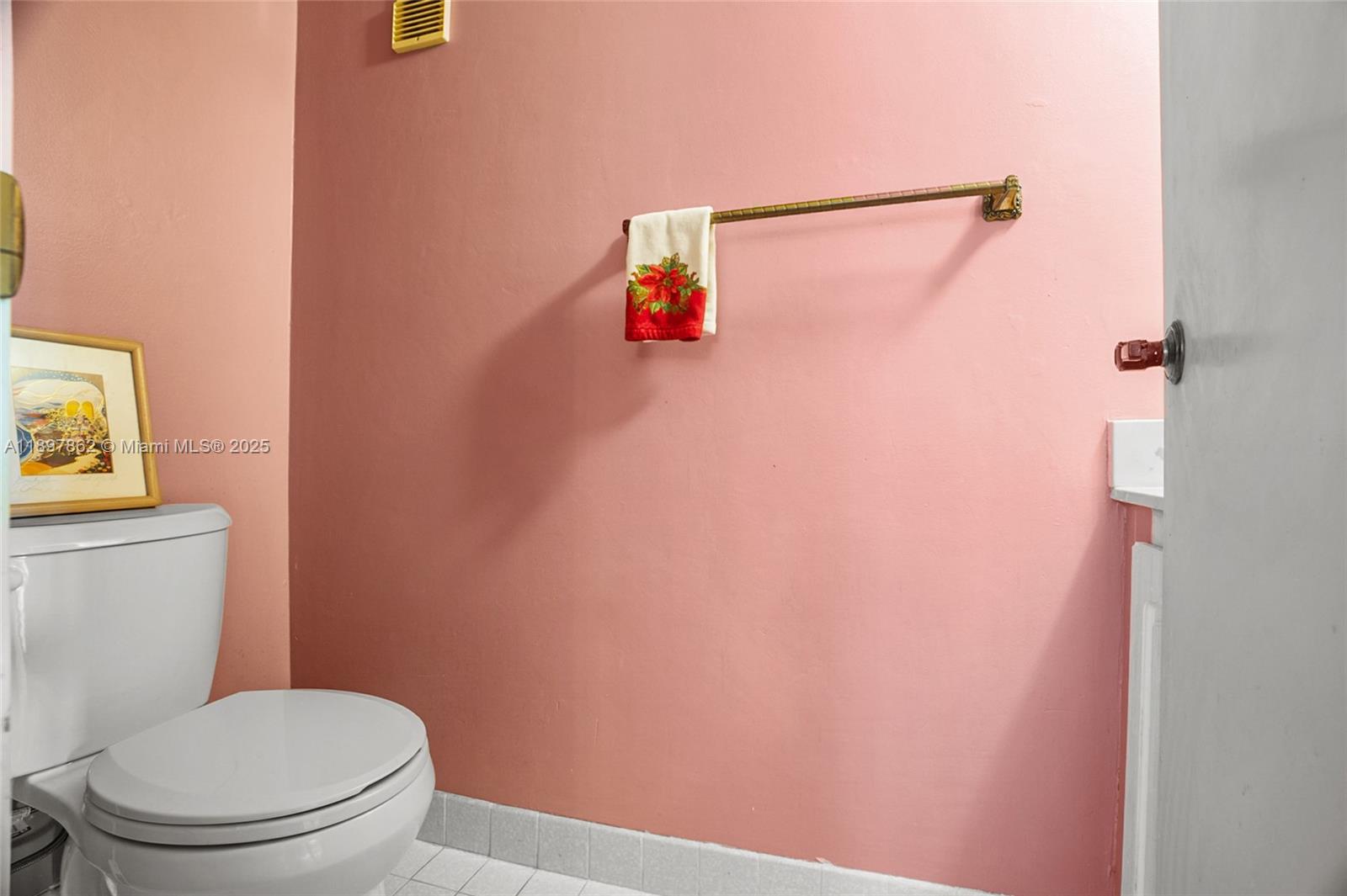 3940 Inverrary Boulevard, Unit 304A Lauderhill, FL 33319 - Photo 7 of 28 a white toilet sitting next to a shower curtain