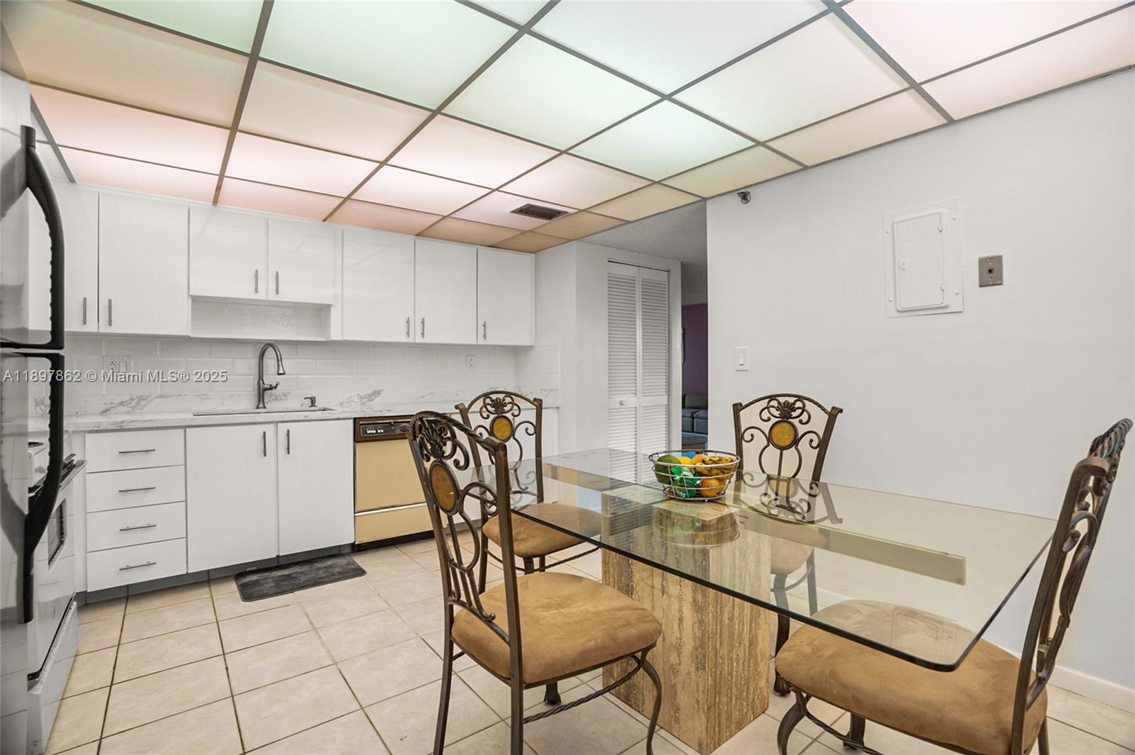 3940 Inverrary Boulevard, Unit 304A Lauderhill, FL 33319 - Photo 9 of 28 a dining room with furniture and wooden floor