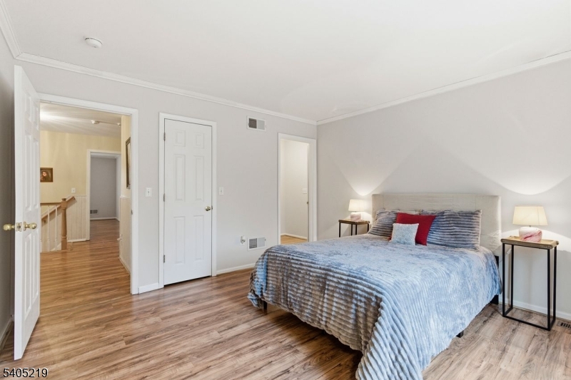 15 Mountainview Drive Andover, NJ 07821 - Photo 25 of 48 a bedroom with a bed and wooden floor