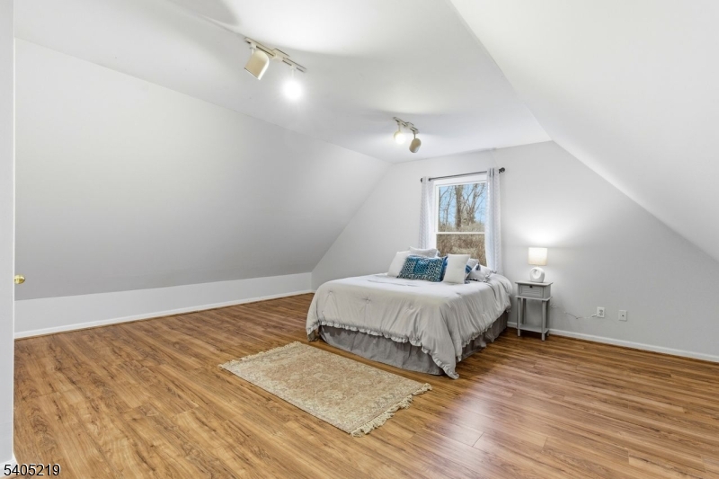 15 Mountainview Drive Andover, NJ 07821 - Photo 29 of 48 a bedroom with a bed and a night stand