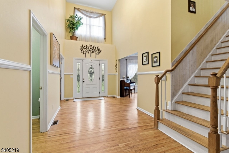 15 Mountainview Drive Andover, NJ 07821 - Photo 3 of 48 a view of a hallway with wooden floor and staircase