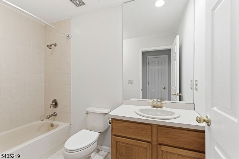 15 Mountainview Drive Andover, NJ 07821 - Photo 31 of 48 a bathroom with a sink toilet vanity and shower