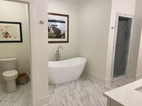 a bathroom with a toilet and a sink