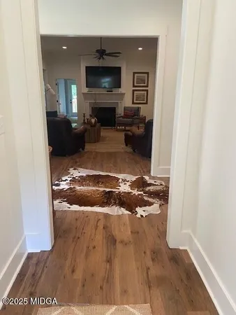 a view of a livingroom with furniture and a flat screen tv