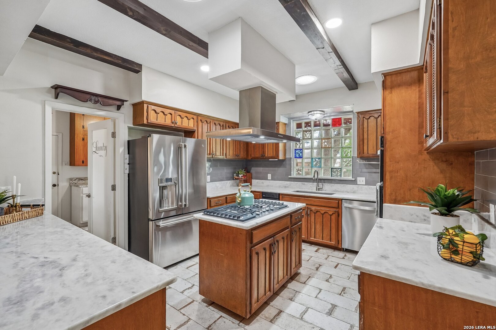 20632 Timber Rose Drive Garden Ridge, TX 78266 - Photo 19 of 46 a kitchen with stainless steel appliances granite countertop a sink stove and refrigerator
