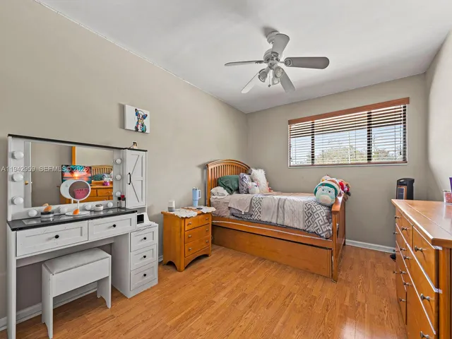 a bedroom with furniture and a window
