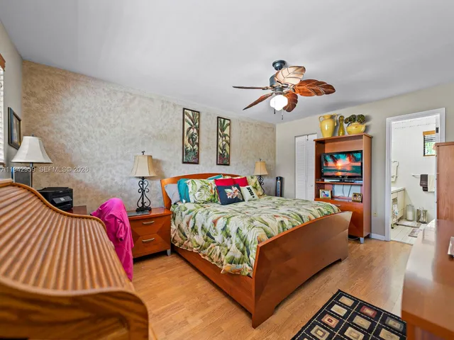 a bedroom with a bed and dresser