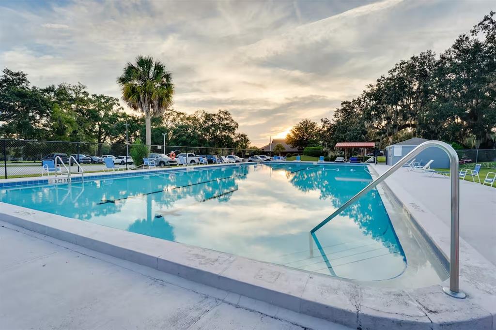 6355 Northwest 106th Place Alachua, FL 32615 - Photo 11 of 11 a view of a lake with a swimming pool