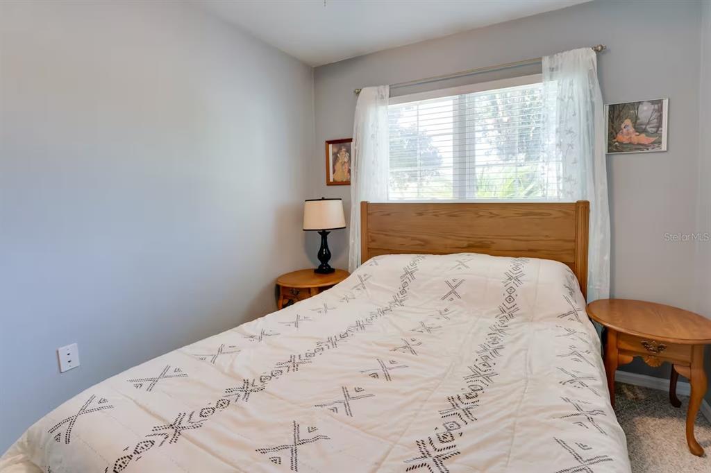 6355 Northwest 106th Place Alachua, FL 32615 - Photo 4 of 11 a bedroom with a bed and a window