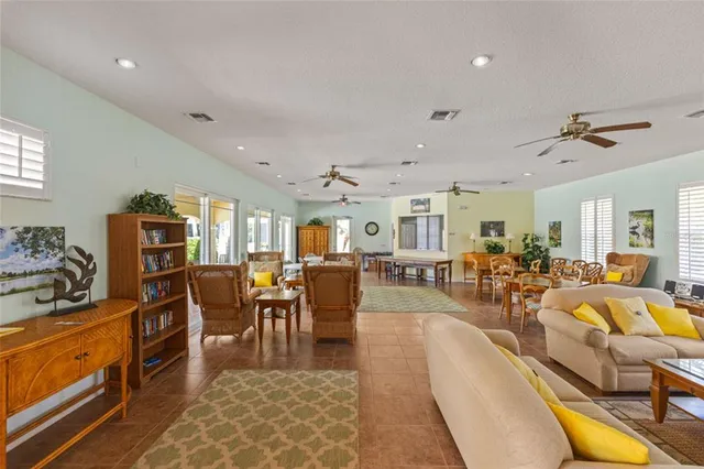 a view of a white house with a yard