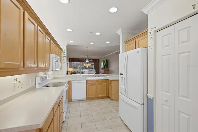 a kitchen with a refrigerator and a sink