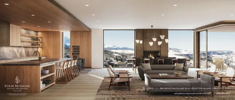 a living room with furniture and large windows