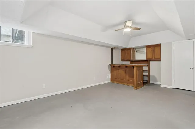 a view of a livingroom with an empty space and a fireplace
