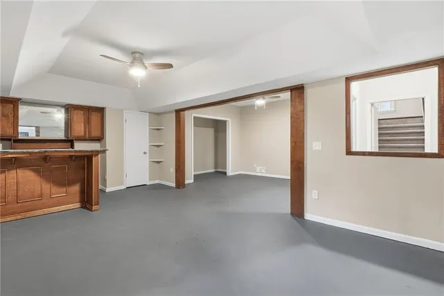 a view of kitchen with cabinets