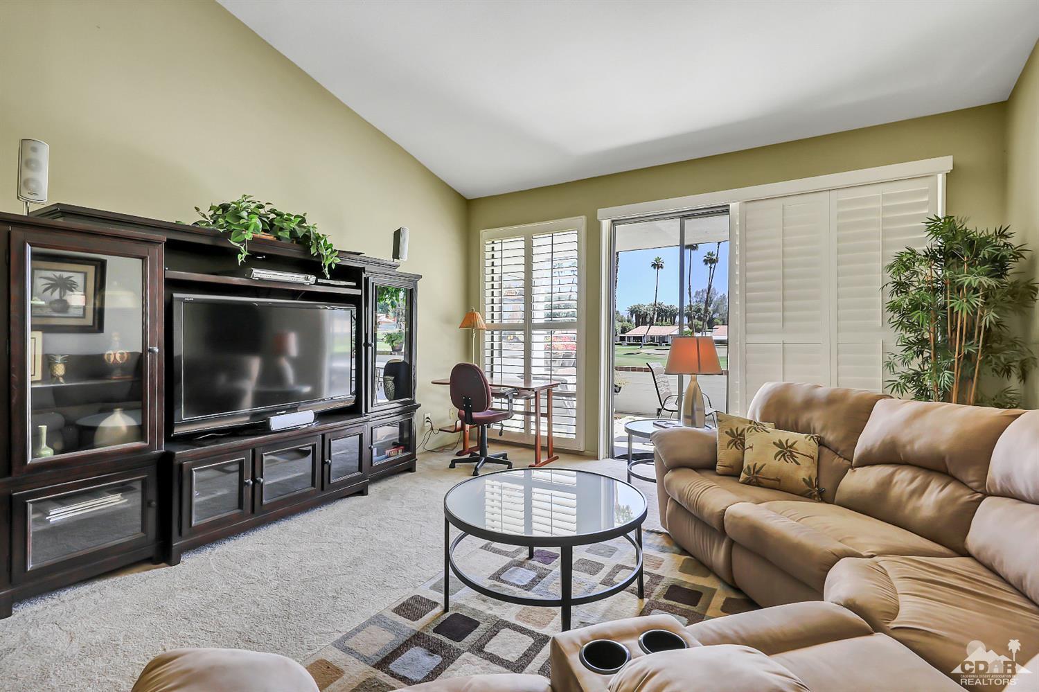 52 Durango Circle Rancho Mirage, CA 92270 - Photo 1 of 20 a living room with furniture and a flat screen tv