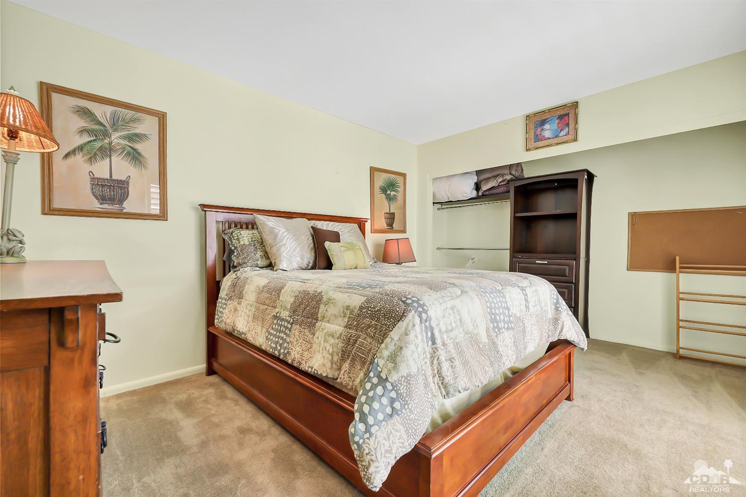 52 Durango Circle Rancho Mirage, CA 92270 - Photo 12 of 20 a bed room with a bed and a night stand