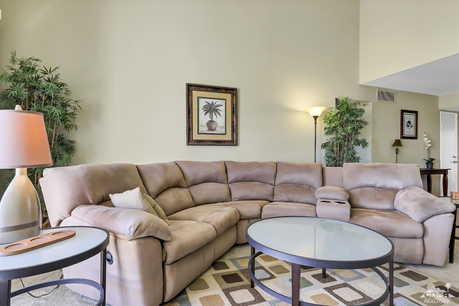 52 Durango Circle Rancho Mirage, CA 92270 - Photo 3 of 20 a living room with furniture a couch and a potted plant