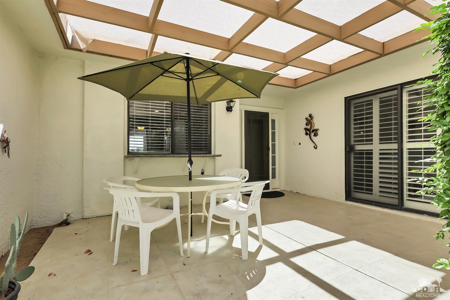 52 Durango Circle Rancho Mirage, CA 92270 - Photo 7 of 20 a table and chairs in patio