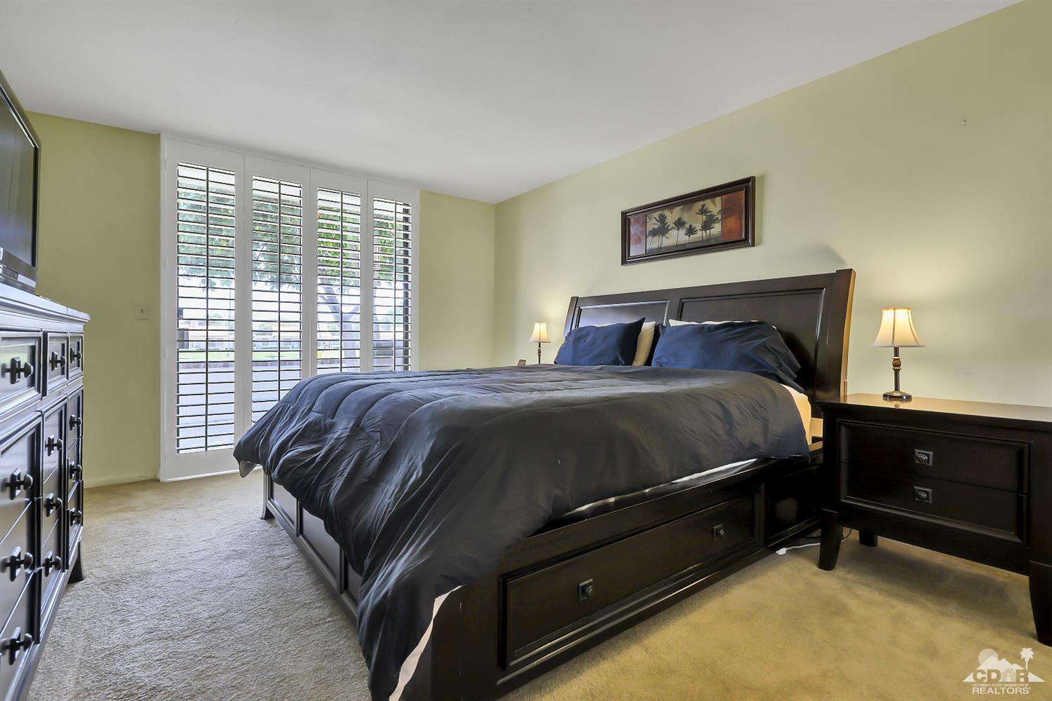 52 Durango Circle Rancho Mirage, CA 92270 - Photo 9 of 20 a bedroom with a bed and a window