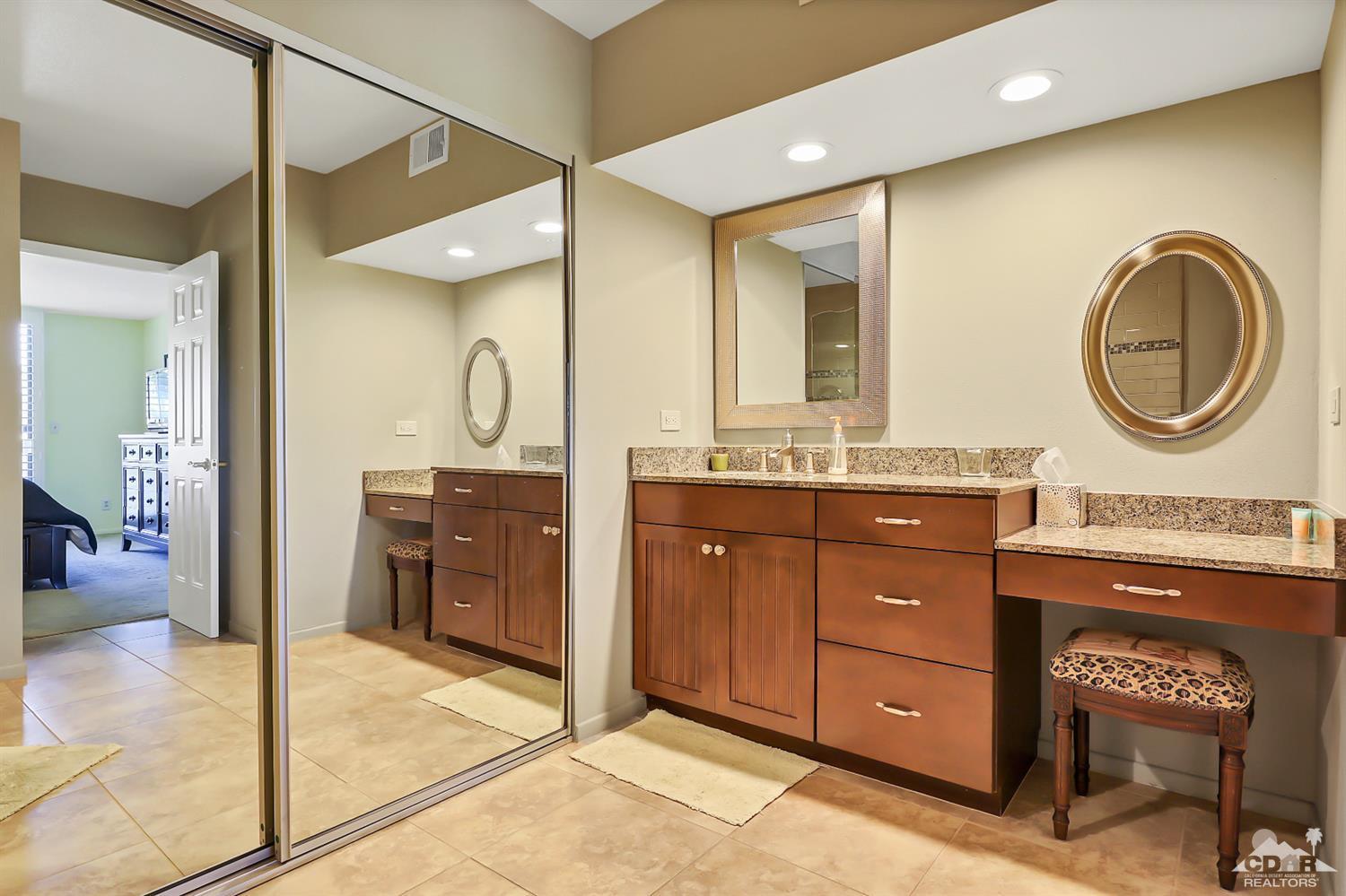52 Durango Circle Rancho Mirage, CA 92270 - Photo 10 of 20 a spacious bathroom with a granite countertop sink a mirror and a shower