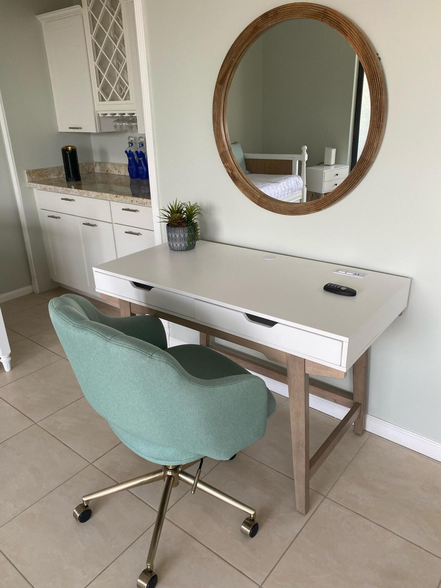1605 Highway 1, Unit 401M3 Jupiter, FL 33477 - Photo 12 of 28 a living room with furniture and a mirror