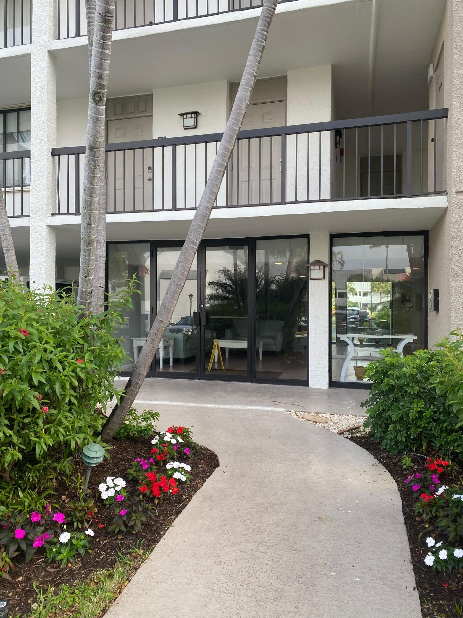 1605 Highway 1, Unit 401M3 Jupiter, FL 33477 - Photo 16 of 28 a front view of a house