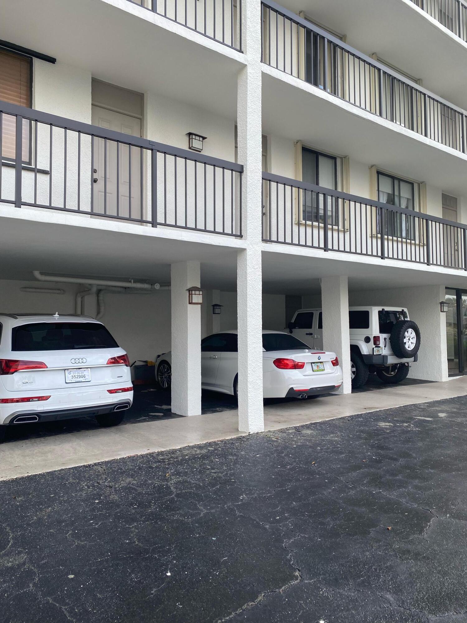 1605 Highway 1, Unit 401M3 Jupiter, FL 33477 - Photo 17 of 28 a view of car parked in front of a building