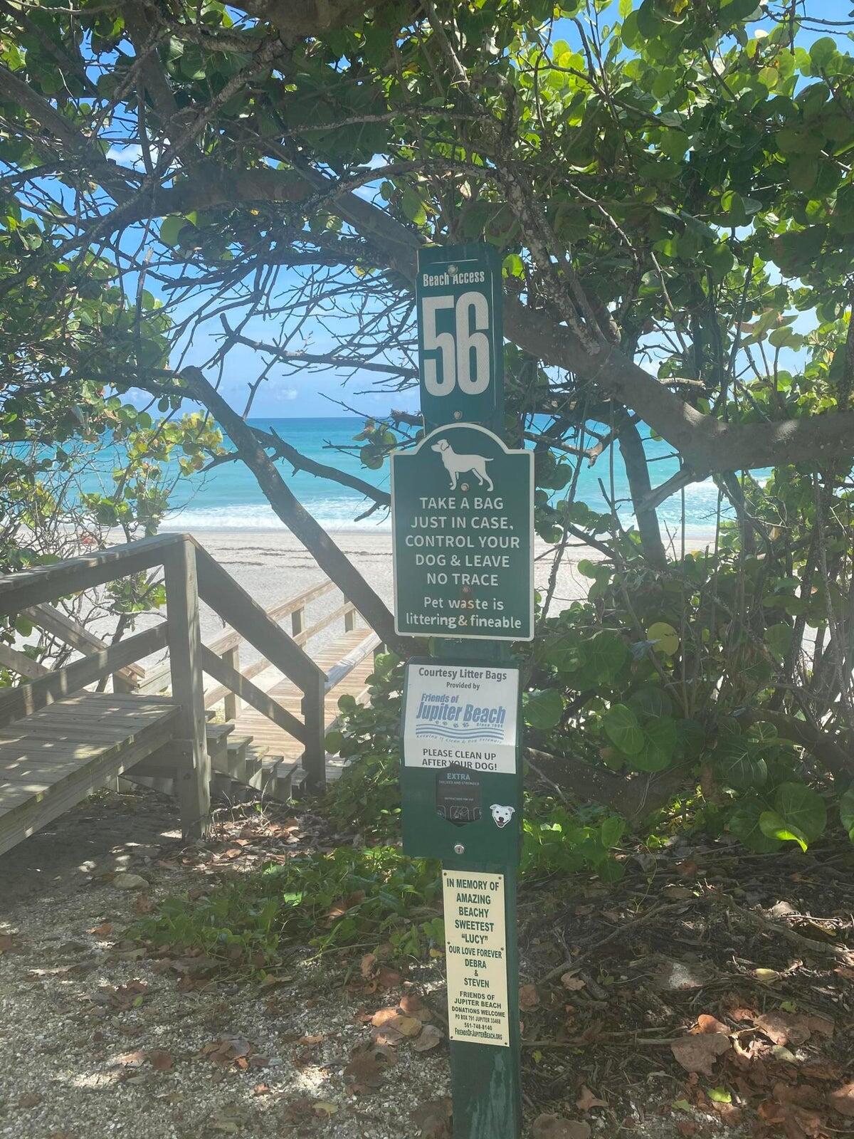 1605 Highway 1, Unit 401M3 Jupiter, FL 33477 - Photo 26 of 28 a sign that is on a tree