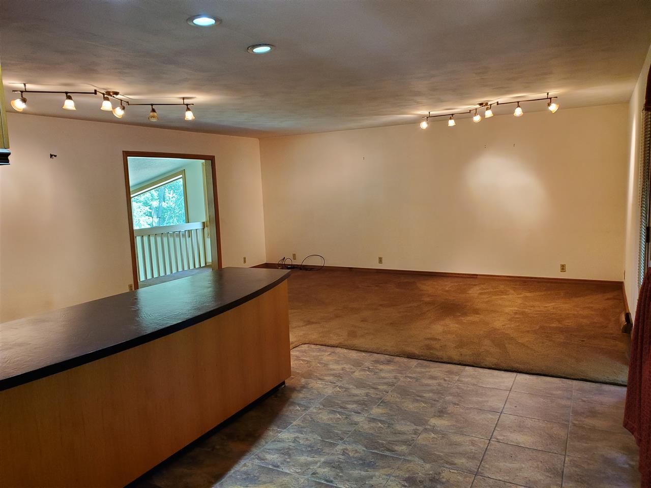 3514 North River Road Oregon, IL 61061 - Photo 11 of 25 an empty room with wooden floor and windows