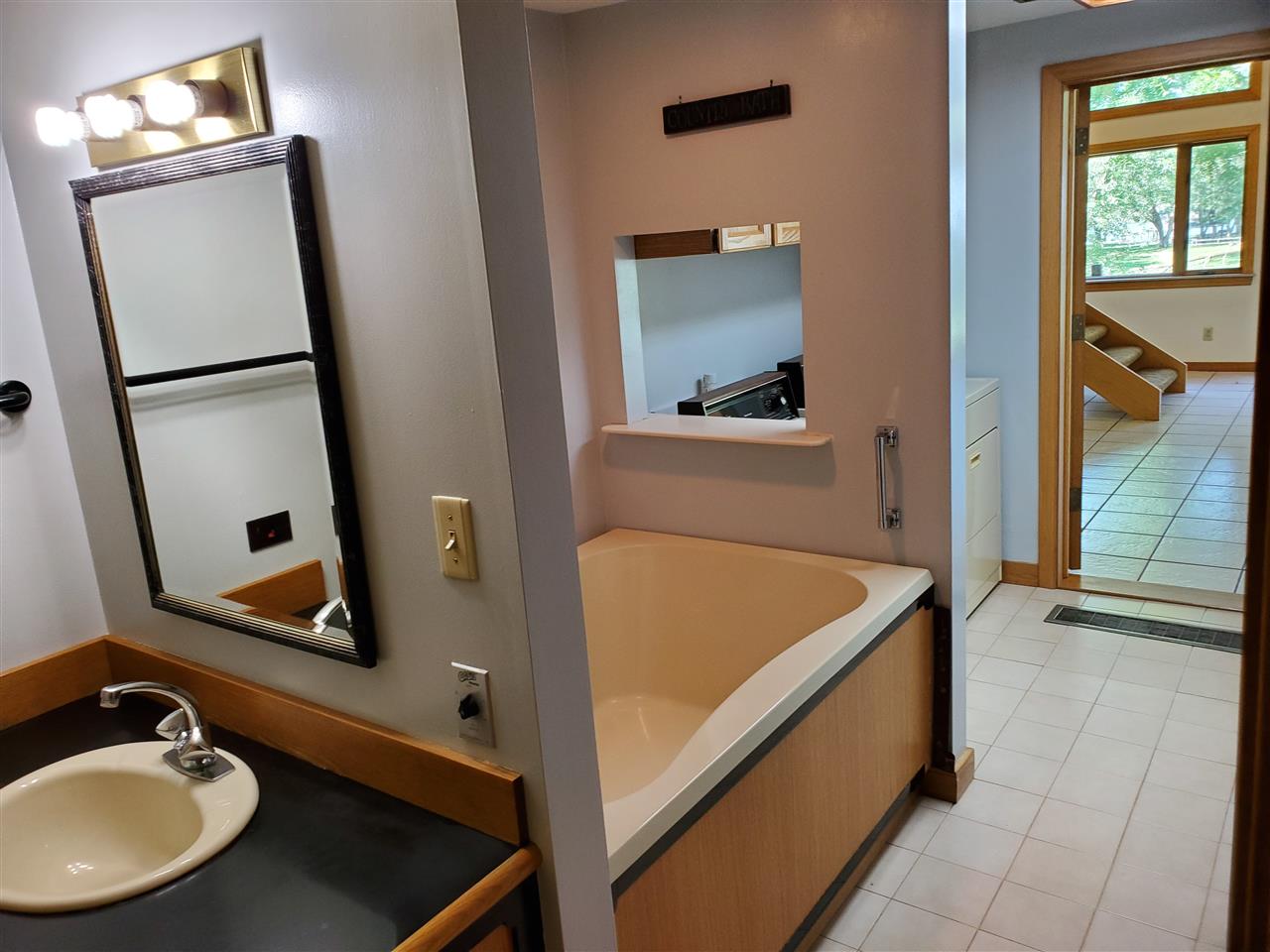 3514 North River Road Oregon, IL 61061 - Photo 14 of 25 a bathroom with a sink and a mirror