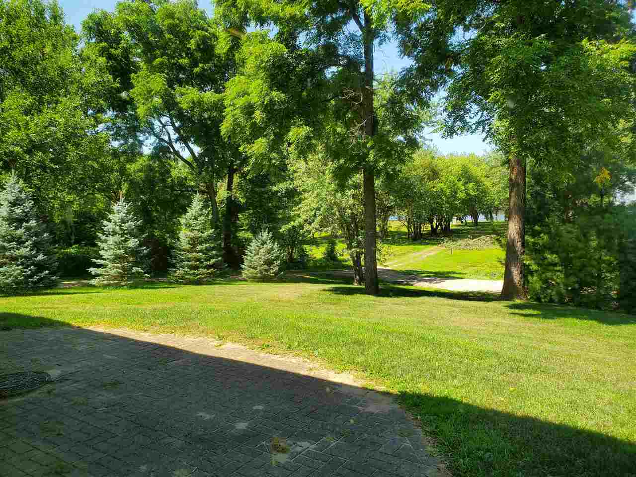 3514 North River Road Oregon, IL 61061 - Photo 20 of 25 a view of a big yard with a trees
