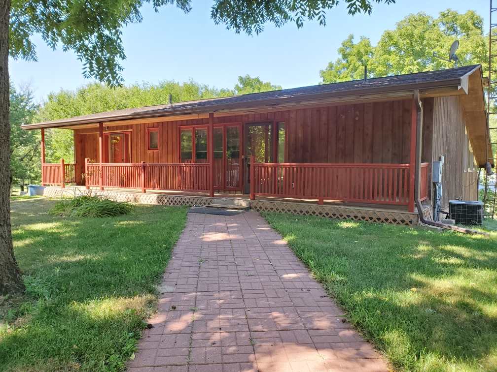 3514 North River Road Oregon, IL 61061 - Photo 21 of 25 a front view of a house with garden