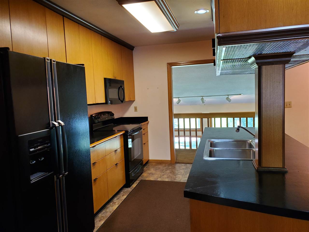 3514 North River Road Oregon, IL 61061 - Photo 7 of 25 a kitchen with stainless steel appliances a refrigerator and a stove