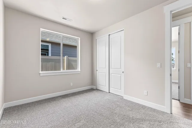 a view of empty room with windows