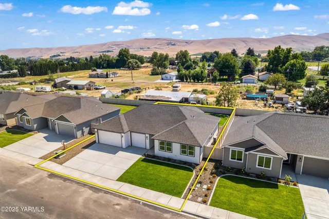 a view of a swimming pool and lounge chairs