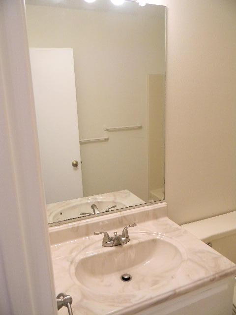 2844 Old Mill Way Crestview, FL 32539 - Photo 18 of 49 a bathroom with a sink and a mirror