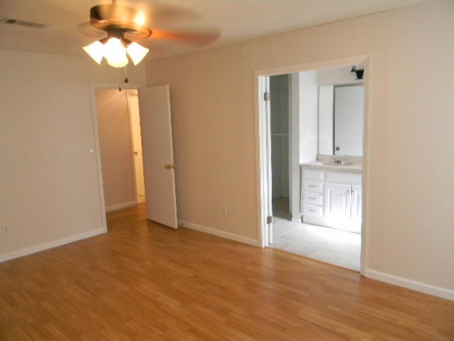 2844 Old Mill Way Crestview, FL 32539 - Photo 23 of 49 wooden floor in an empty room with a window
