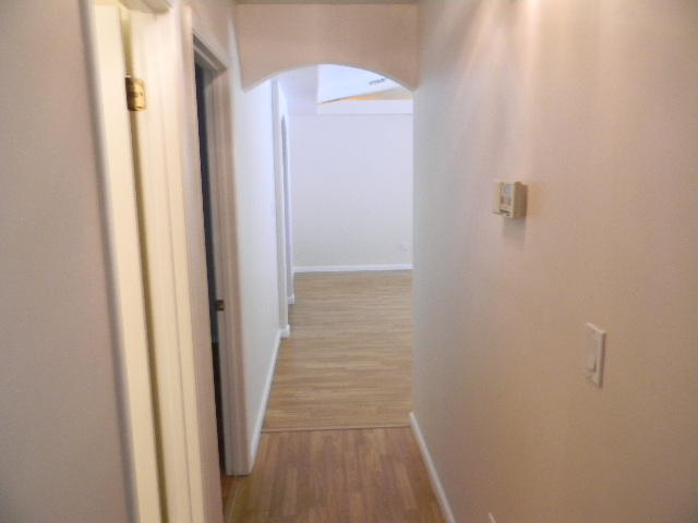 2844 Old Mill Way Crestview, FL 32539 - Photo 29 of 49 a view of a hallway with wooden floor