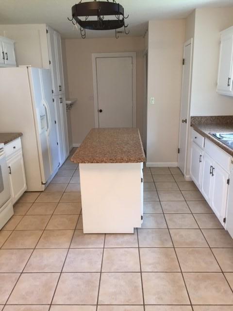 2844 Old Mill Way Crestview, FL 32539 - Photo 33 of 49 a kitchen with a stove a refrigerator and a stove