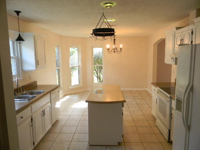 2844 Old Mill Way Crestview, FL 32539 - Photo 37 of 49 a bathroom with a granite countertop sink a toilet and shower